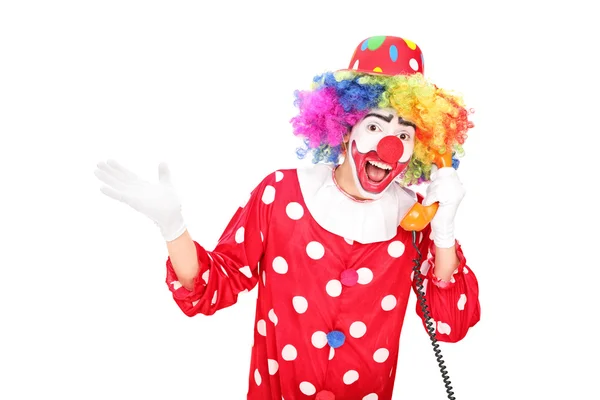 Clown praten over een vintage telefoon — Stockfoto