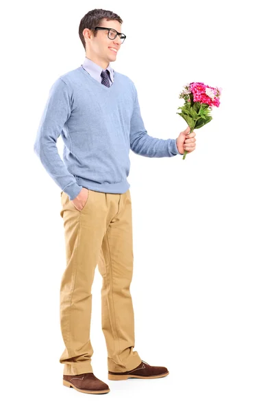 Young man holding flowers — Stock Photo, Image