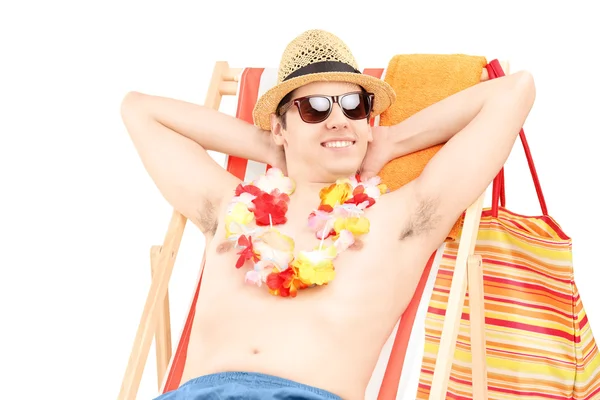 Male on beach chair — Stock Photo, Image