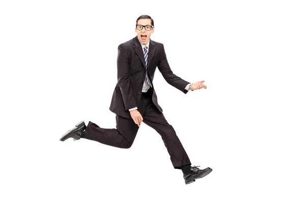 Man in suit playing air guitar — Stock Photo, Image