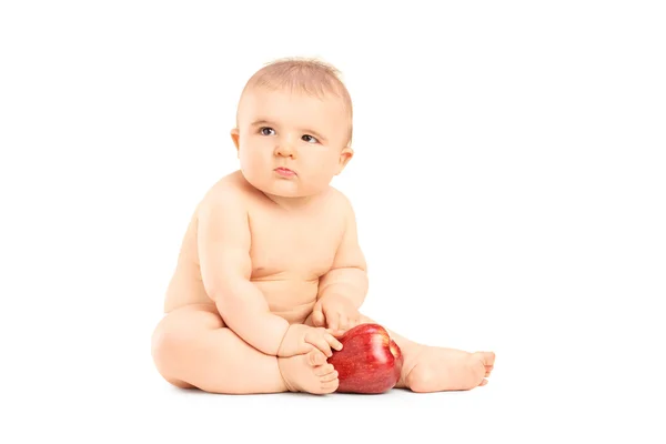 Bambino che gioca con una mela — Foto Stock