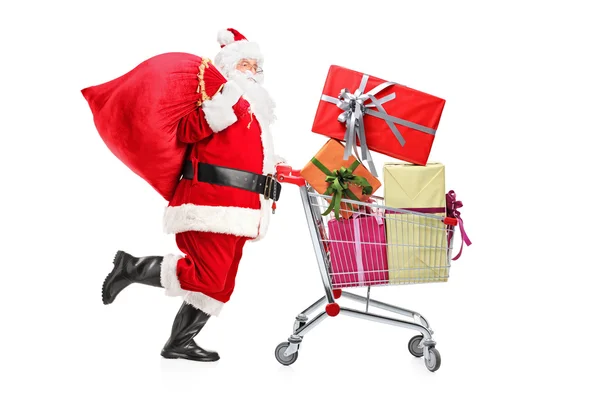 Babbo Natale spingendo carrello della spesa — Foto Stock