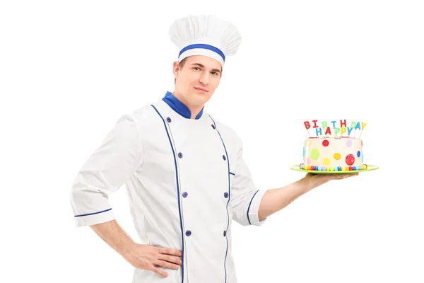 Male chef holding birthday cake — Stock Photo, Image