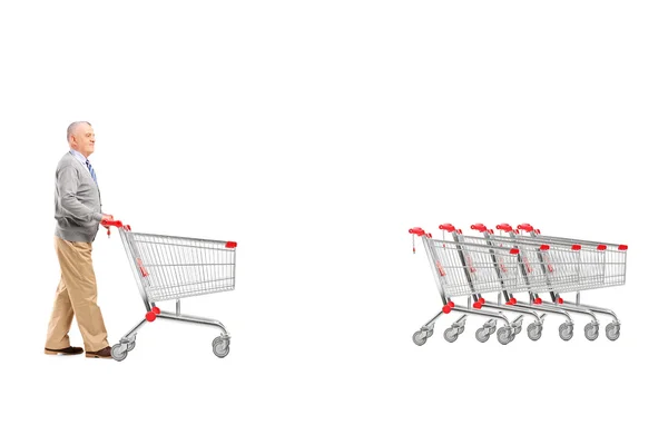 Man terug een lege shopping cart — Stockfoto