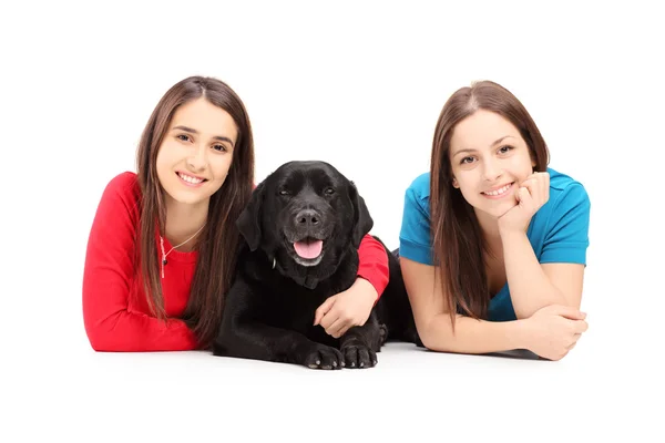Females posing with dog — Stock Photo, Image