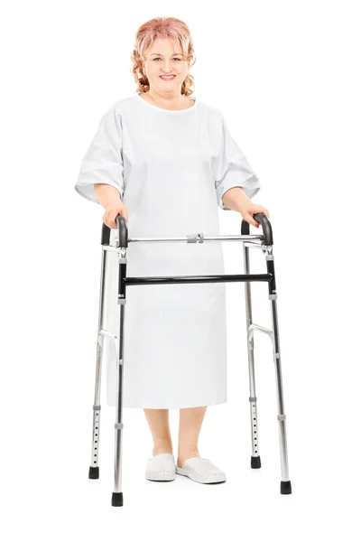 Female patient walking with walker — Stock Photo, Image