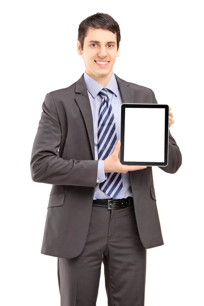 Smiling businessman showing a tablet — Stock Photo, Image