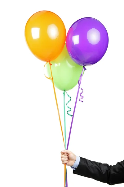 Hand met gekleurde ballonnen — Stockfoto