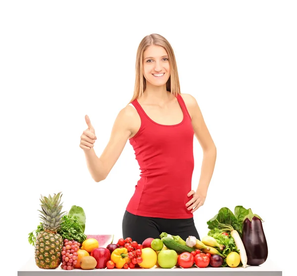 Female athlete giving thumb up — Stock Photo, Image