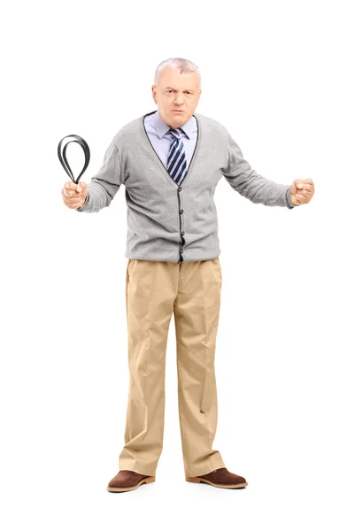 Angry mature man holding belt — Stock Photo, Image