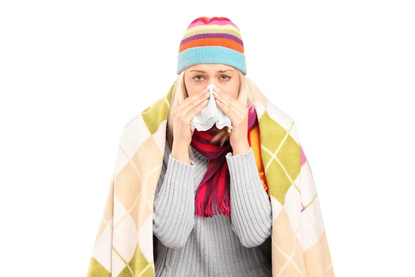 Woman blowing her nose — Stock Photo, Image