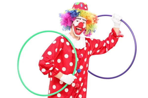 Clown mit zwei Hula-Hoop-Reifen — Stockfoto