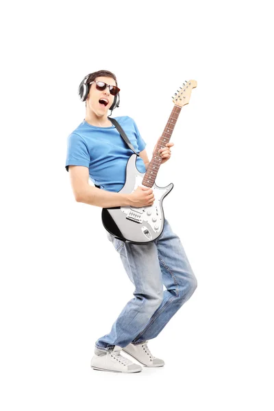 Musician playing an electric guitar — Stock Photo, Image