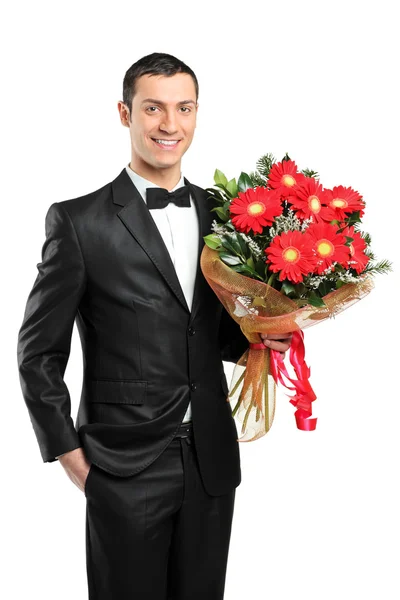 Uomo in possesso di bouquet di gerbere — Foto Stock