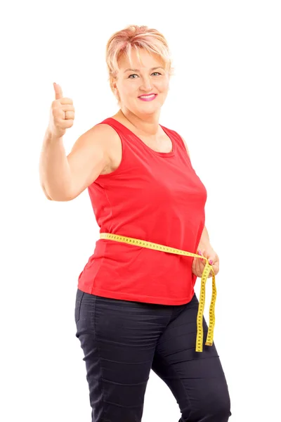 Woman measuring waist after diet — Stock Photo, Image