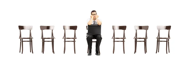 Bored man on chair — Stock Photo, Image