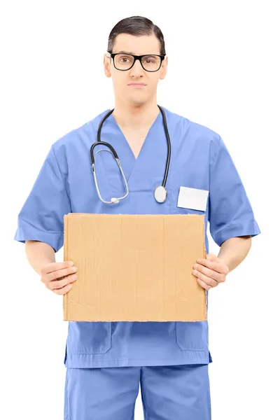 Nevrlý muž lékař drží ceduli kreslený — Stock fotografie