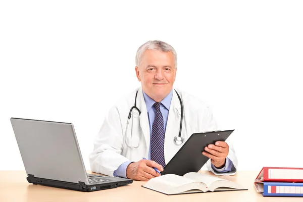 Mature doctor posing in office — Stock Photo, Image