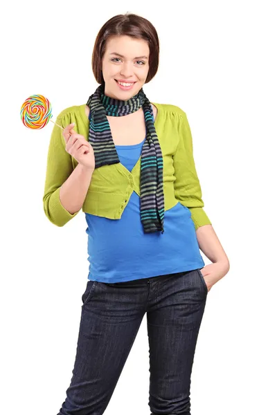 A happy young girl holding a lollypop — Stock Photo, Image