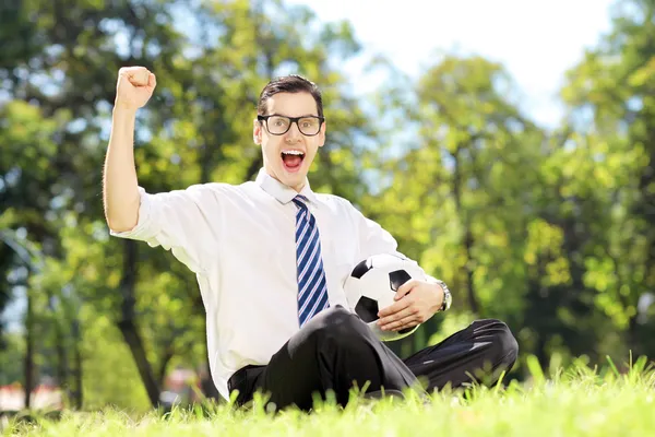 Young cheerful man holding a ball — Stock Photo, Image