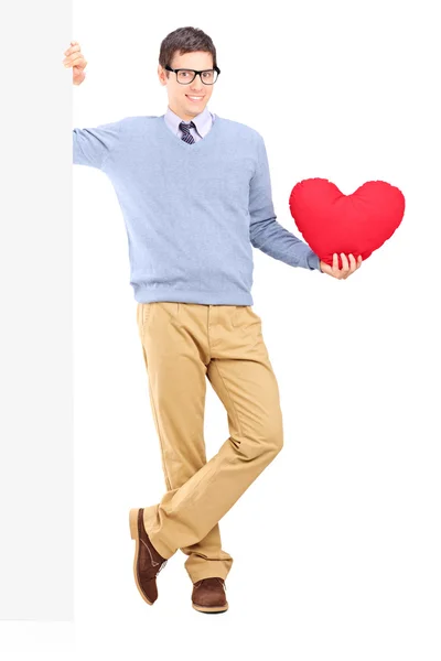 Young male holding red heart — Stock Photo, Image