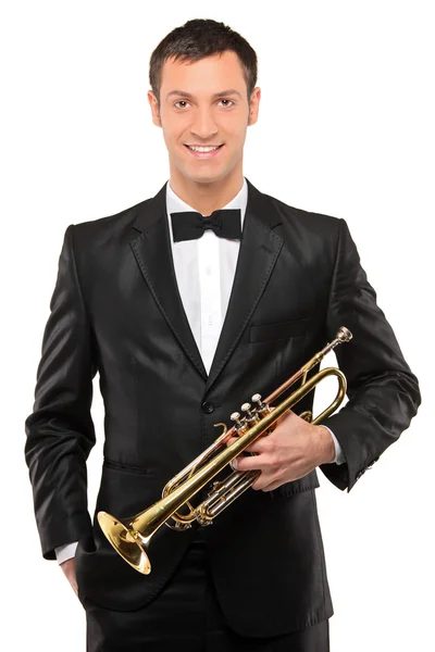 Young man holding trumpet — Stock Photo, Image
