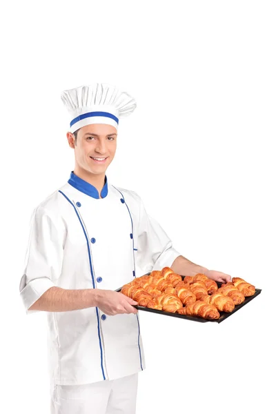 Padeiro segurando croissants — Fotografia de Stock