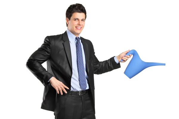 Businessman holding watering can — Stock Photo, Image