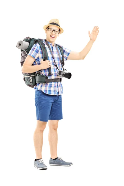 Male tourist waving with his hand — Stock Photo, Image