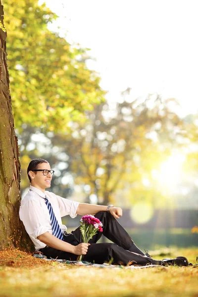 Guy with flowers — Stock Photo, Image
