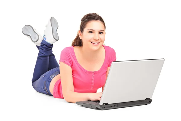 Teenager doing homework on laptop — Stock Photo, Image