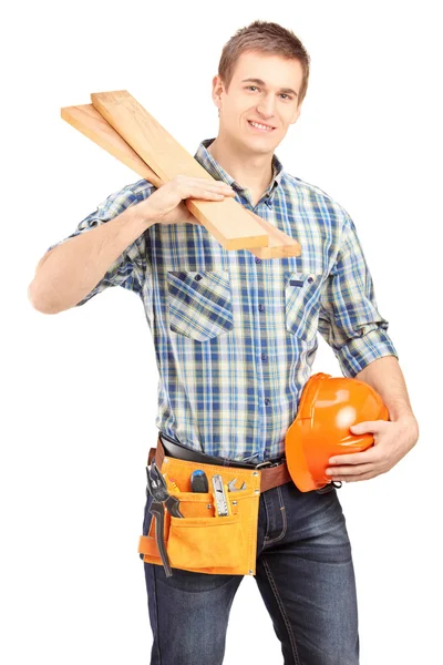 Carpenter holding helmet and sills — Stock Photo, Image