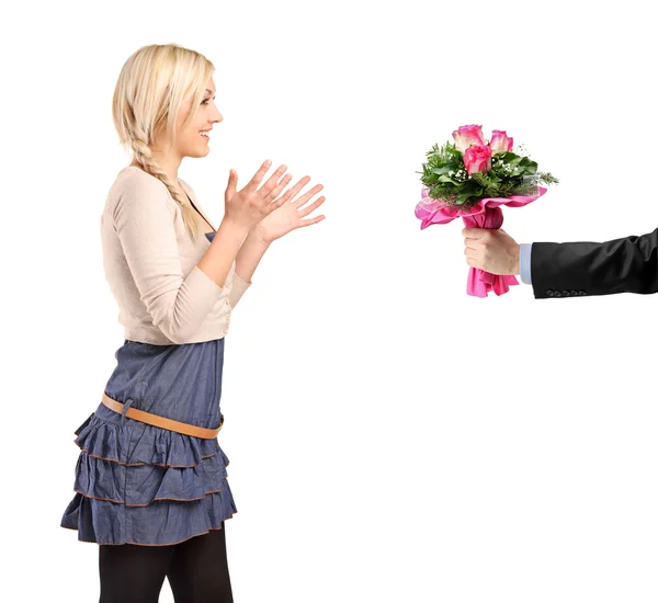 Girl accepting bunch of flowers — Stock Photo, Image