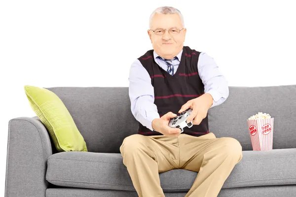 Senior man playing video games — Stock Photo, Image