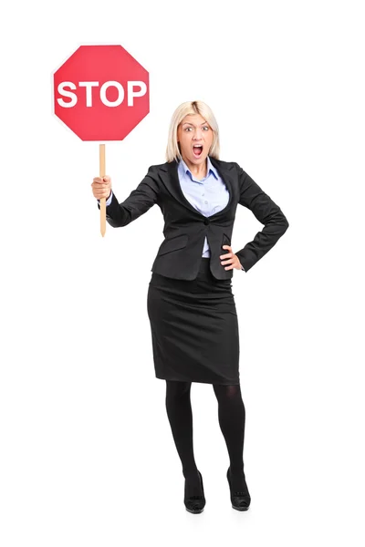 Businesswoman holding traffic sign stop — Stock Photo, Image