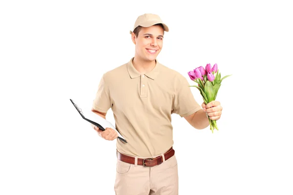 Entrega menino segurando flores — Fotografia de Stock