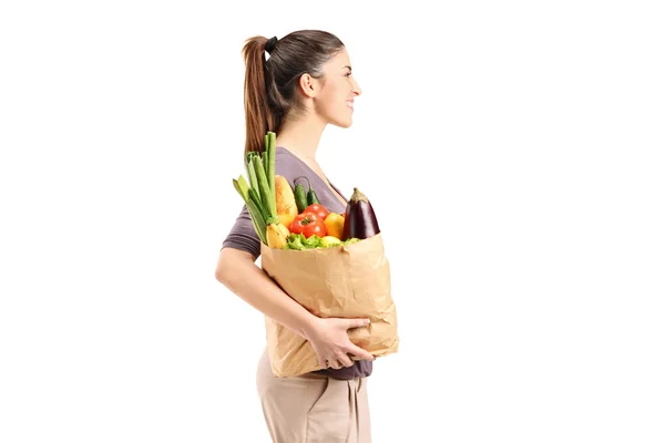 Female holding bag with groceries — Stock Photo, Image