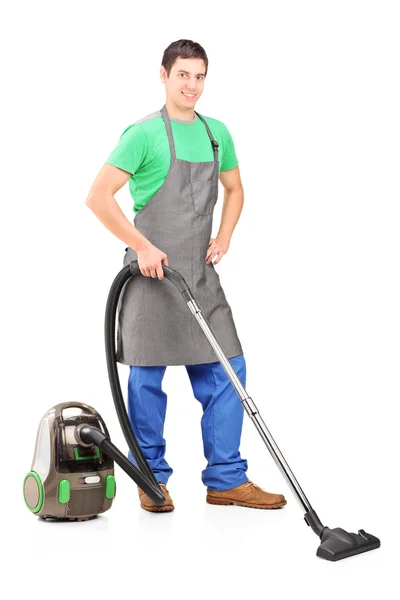 Man cleaning with vacuum cleaner — Stock Photo, Image