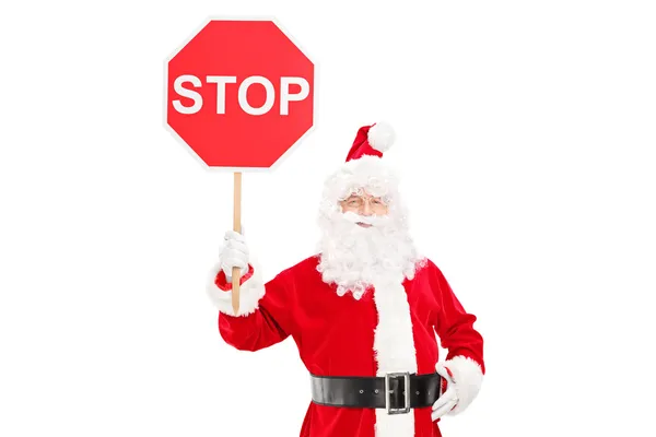 Санта-Клаус держит знак "стоп" — стоковое фото