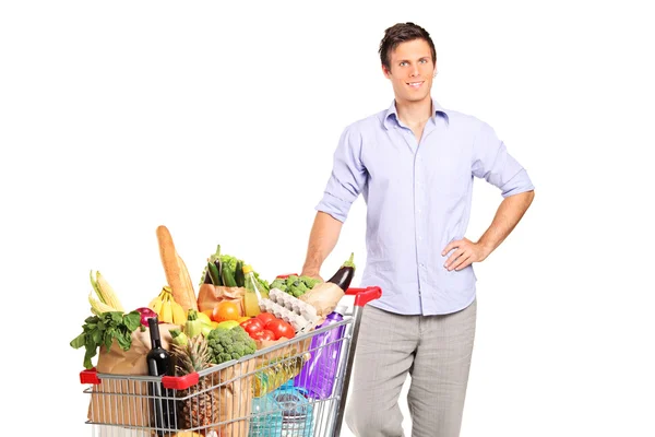 Male holding shopping cart — Stock Photo, Image