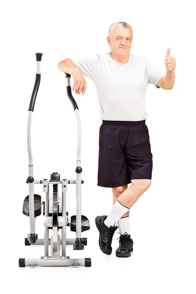 Athlete next to cross trainer — Stock Photo, Image