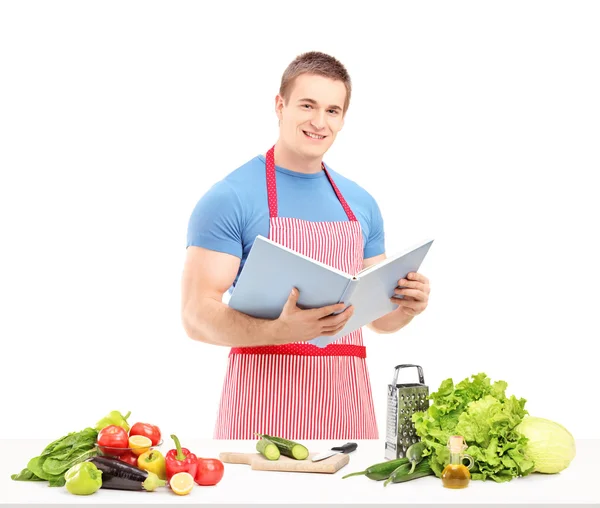 Male chef reading cookbook — Stock Photo, Image