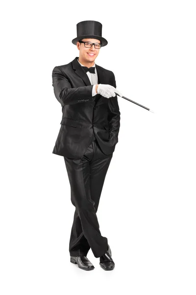 Magician holding magic wand — Stock Photo, Image