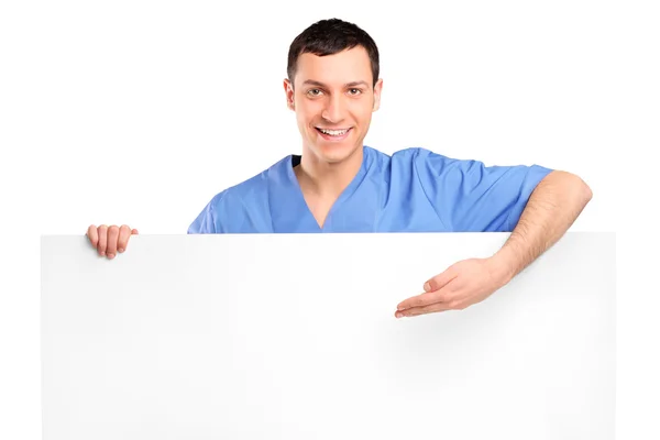 Medical doctor showing on blank panel — Stock Photo, Image