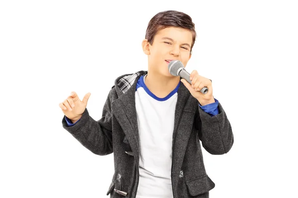 Boy singing on microphone — Stock Photo, Image