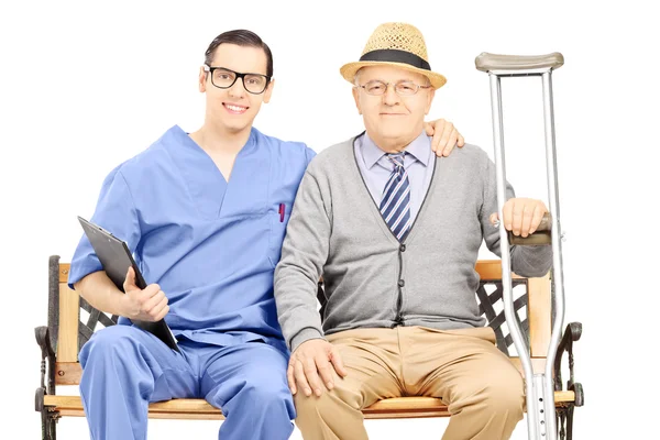 Professional posing with elderly gentleman — Stock Photo, Image