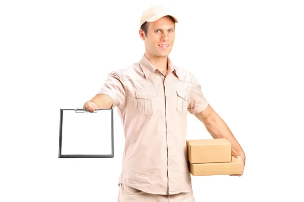 Delivery boy giving clipboard for signature — Stock Photo, Image