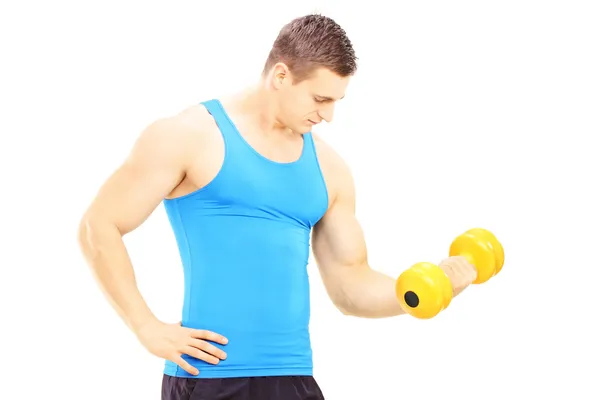 Young guy lifting a dumbbell Stock Picture