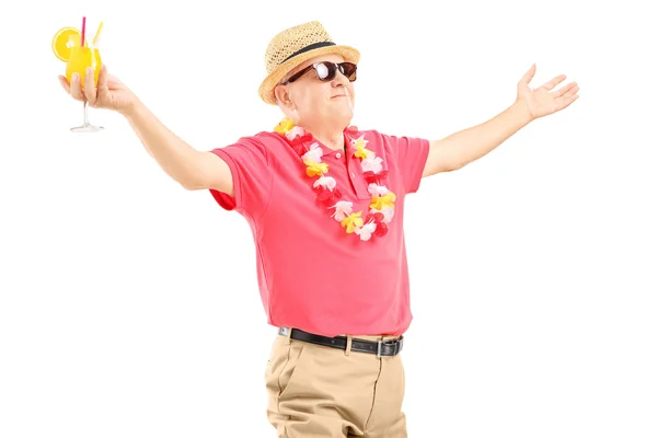 Mature man holding cocktail Royalty Free Stock Images