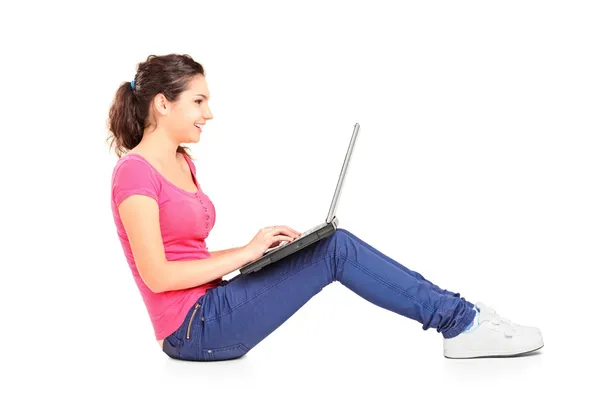 Teenager doing homework on laptop Royalty Free Stock Photos